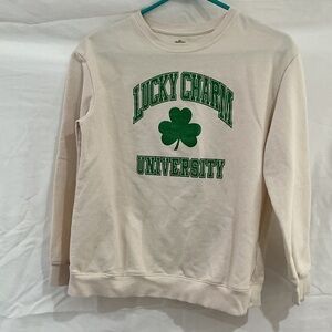 Cream Crewneck Sweatshirt with Green Lucky Charm Graphic
